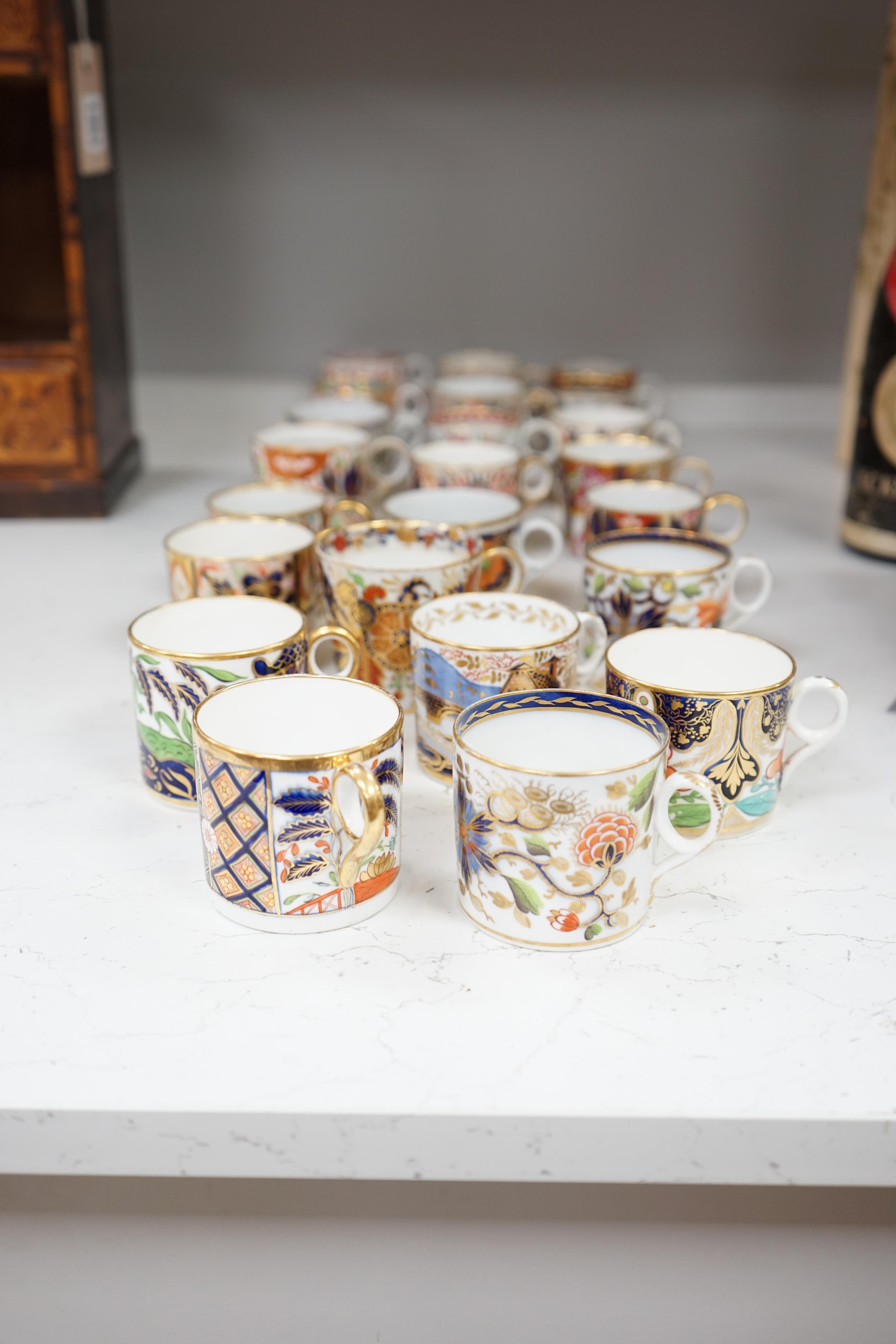 Twelve mixed 1800-1820 English porcelain Imari patterned coffee cans